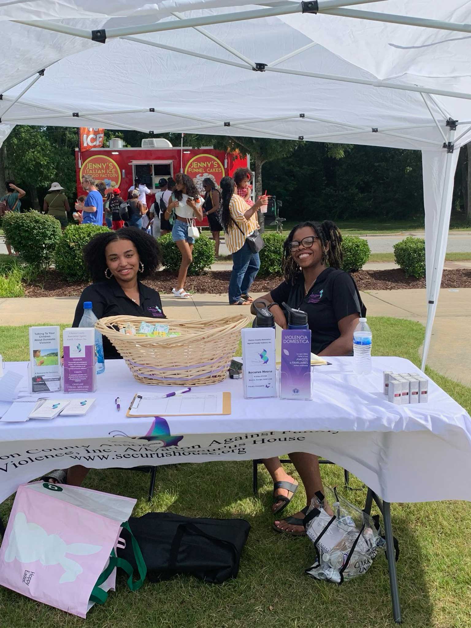 Our Child Advocate and Outreach Support Specialist spreading awareness of domestic violence and available resources to the community at Lee St Juneteenth celebration (2024) in Jonesboro!